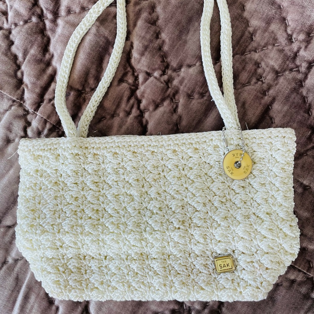 The Sak cream clutch